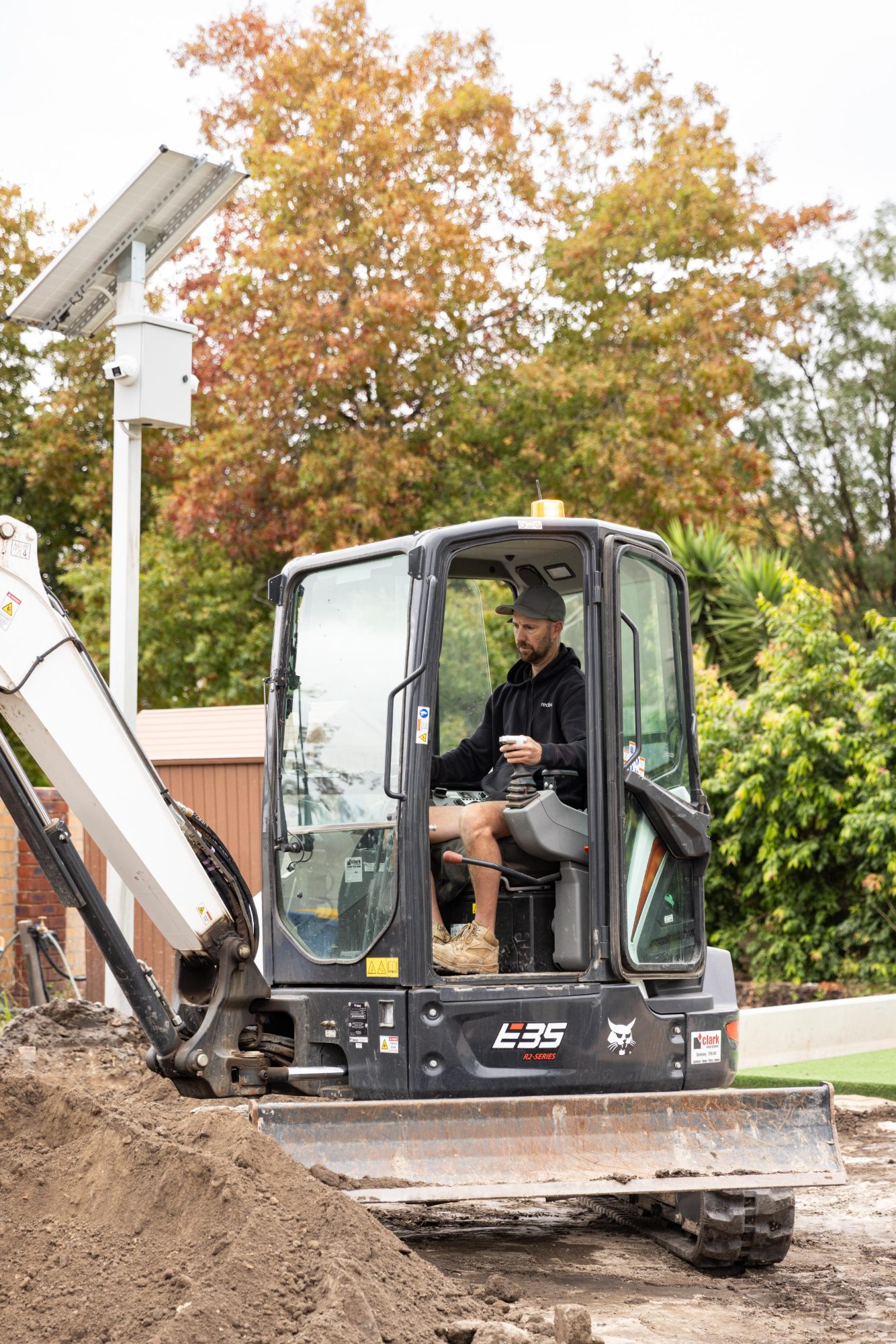 Excavator in the rear yard