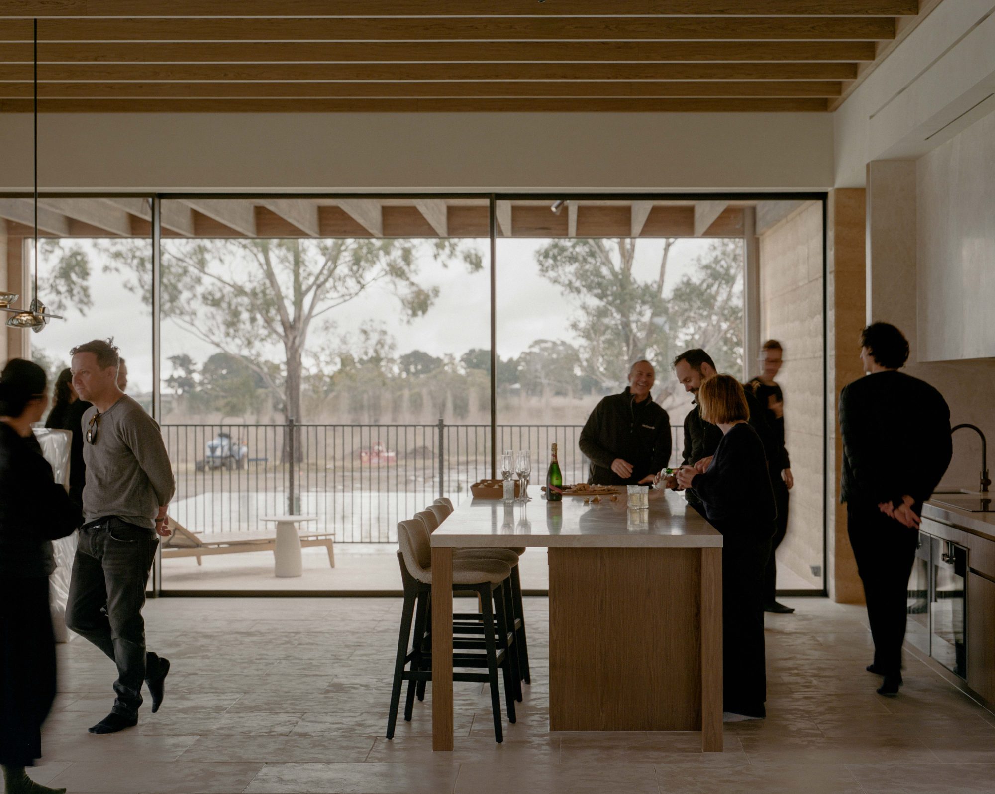 Curved solid-timber island bench in a Macedon Ranges kitchen
