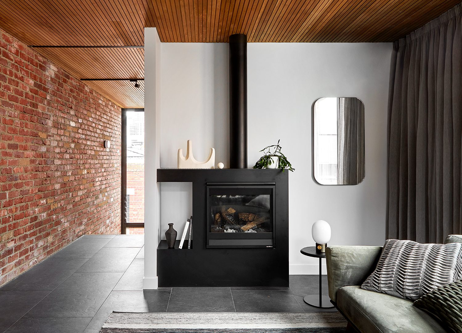Suspended fireplace in a North Melbourne apartment living room